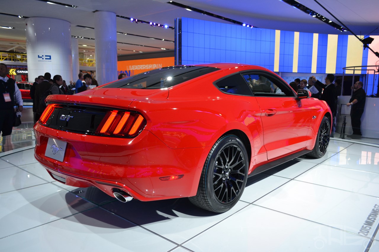 2015 Ford Mustang GT red rear three quarters at NAIAS 2014