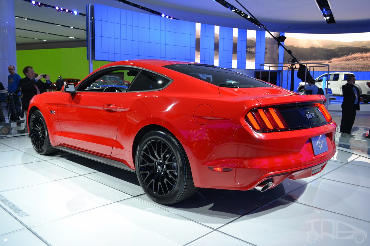 2015 Ford Mustang GT red rear three quarters left at NAIAS 2014