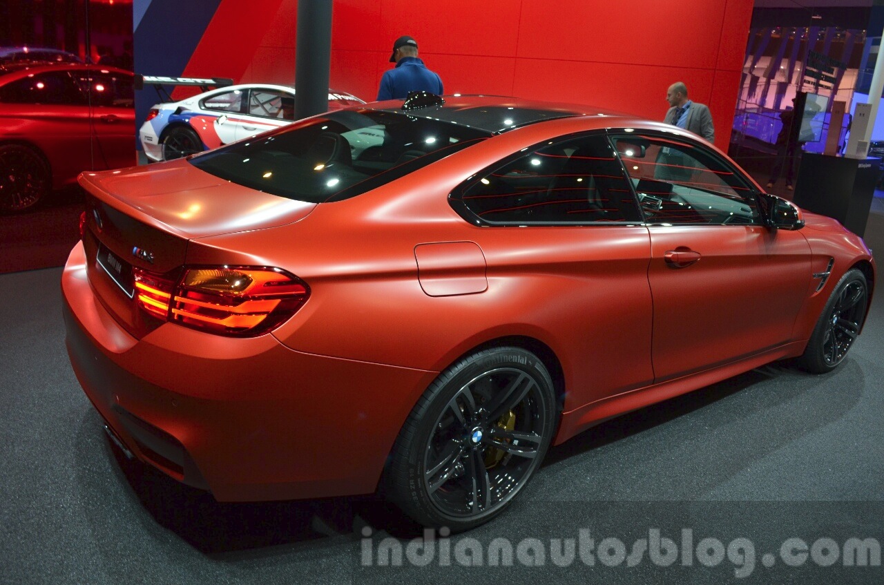 BMW M4 in Frozen Red metallic rear three quarters at iAA 2015