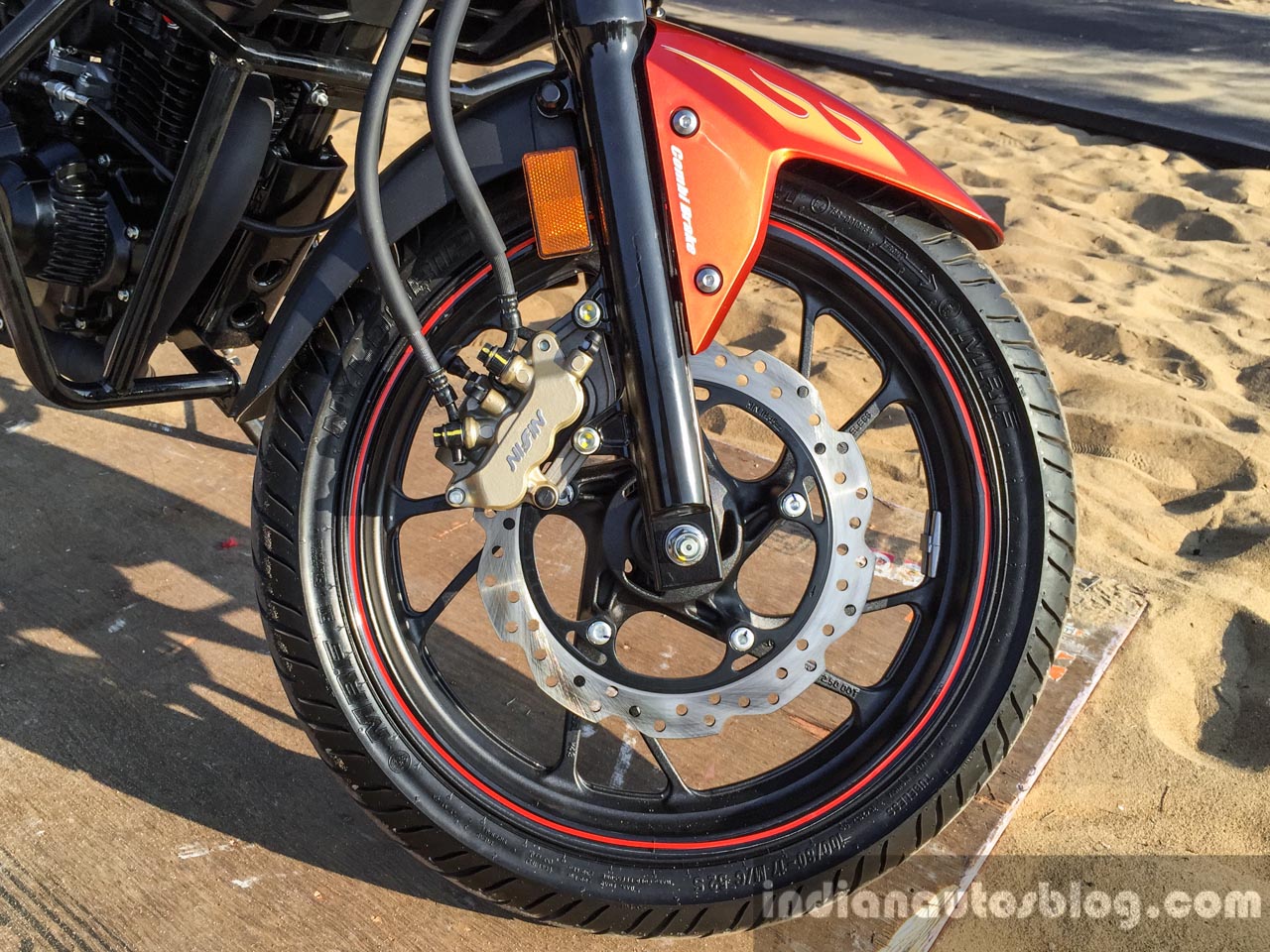 Honda CB 160R orange with stickering front disc Nissin caliper