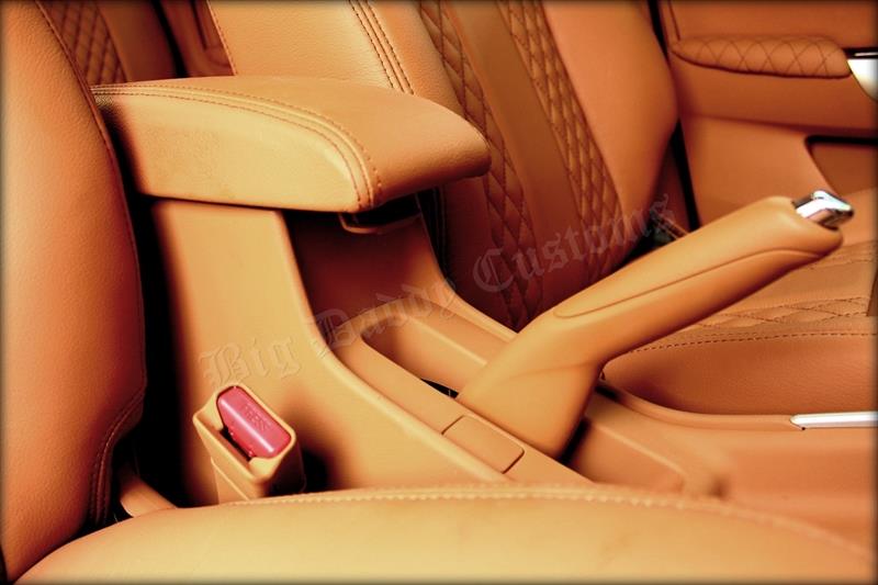 Maruti Baleno with fullycustomized interior armrest and handbrake