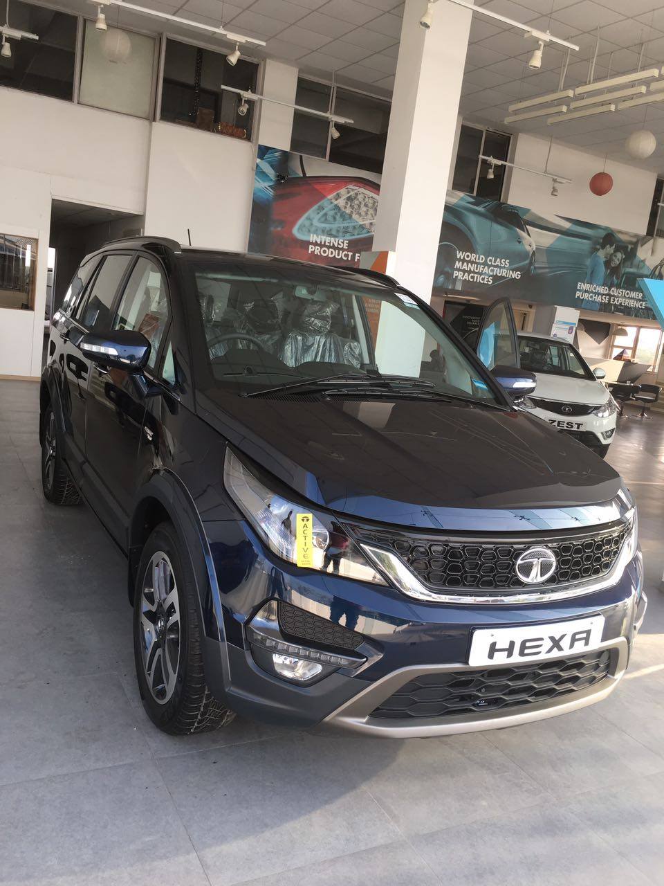 Tata Hexa front quarter at a Gujarati dealership