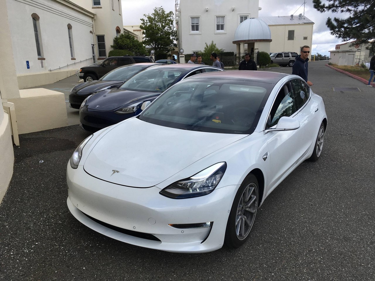 Tesla Model 3 white front three quarters left side spy shots
