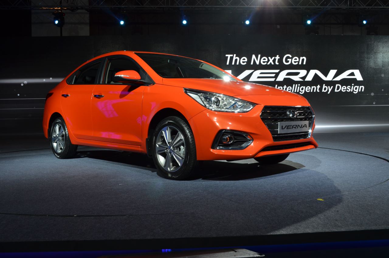 Hyundai Verna 2017 front three quarters flame orange