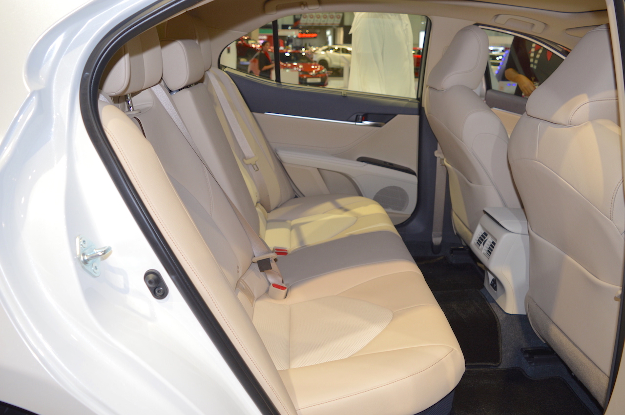 2018 Toyota Camry Hybrid rear seats right side view at 2017 Dubai Motor