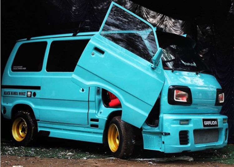 Modified Maruti Omni with scissor doors and clunky body kit looks