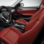 2015 BMW X1 matt coral red dashboard press shot