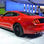 2015 Ford Mustang GT red rear three quarters left at NAIAS 2014