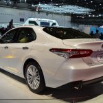 2018 Toyota Camry Hybrid rear three quarters at 2017 Dubai Motor Show