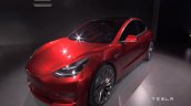 Tesla Model 3 red front three quarters left side