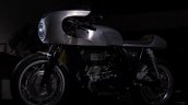 Royal Enfield Continental GT Silver Bullet by white collar bike left side