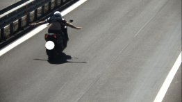 Scooterist fined INR 48k for riding with both hands off the handlebar - Report