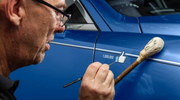 Rolls Royce celebrates reaching a million Facebook fans by painting a 'like' on one