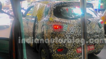 Mahindra S101 (XUV100) spotted with new chrome details - Spied