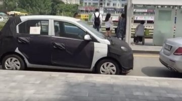 Hyundai AH2 (new Hyundai Santro) spied near a sidewalk in South Korea