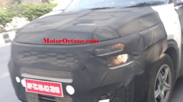 Low-spec Kia SP2i spied again, reveals its wheel cover design