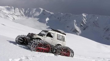 Modified Maruti Gypsy with tank tracks takes on a snow-covered mountain