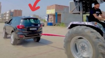 Ford Endeavour Competes with Tractor in Crazy Tug of War Game