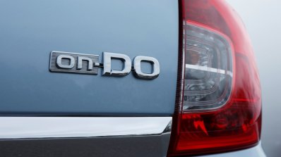 Datsun on-DO badge press shot