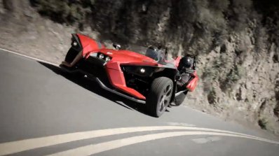 Polaris Slingshot three wheeler press shot front three quarters red