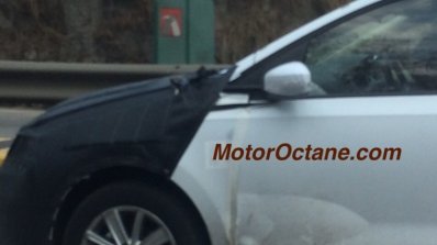 VW Vento facelift front fender camouflaged test mule