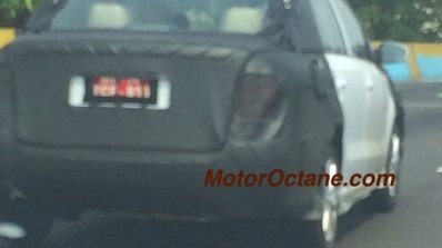 VW Vento facelift rear three quarter left camouflaged test mule