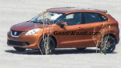 2016 Suzuki Baleno (Maruti YRA) front three quarter orange spotted in the wild