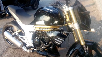 Mahindra Mojo black front quarter spotted