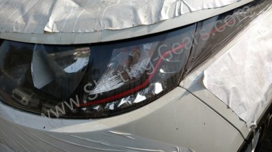 Mahindra KUV100 headlamp trim spied