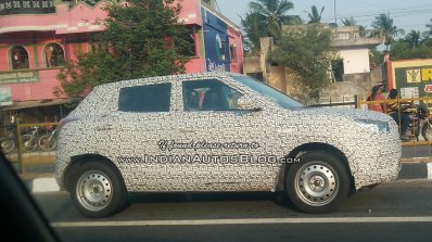 Mahindra S201 base compact SUV front three quarter spied testing