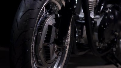 Royal Enfield Continental GT Silver Bullet by white collar bike front wheel