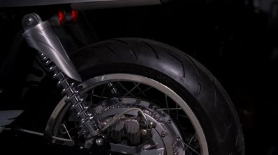 Royal Enfield Continental GT Silver Bullet by white collar bike rear wheel