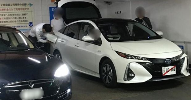 Toyota Prius PHV (Prius Prime) spied next to a Tesla Model S