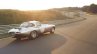 Lightweight Jaguar E-Type press image on track rear three quarter