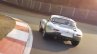 Lightweight Jaguar E-Type press image rear three quarter on track