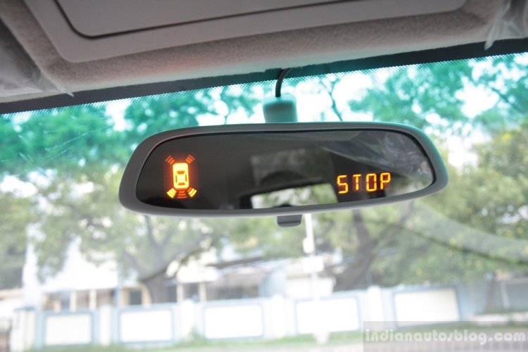 Mahindra Quanto reversing on the inside rear view mirror