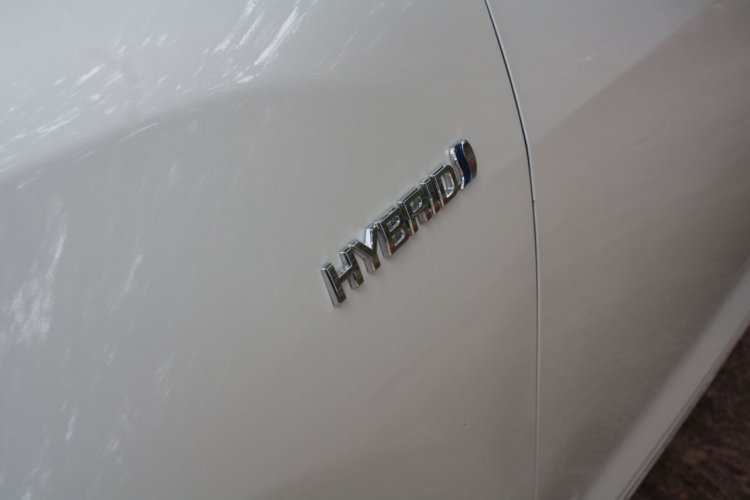 Toyota Camry Hybrid badge on the fender