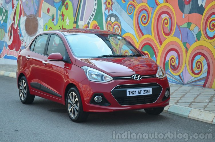 Hyundai Xcent Review red front quarter