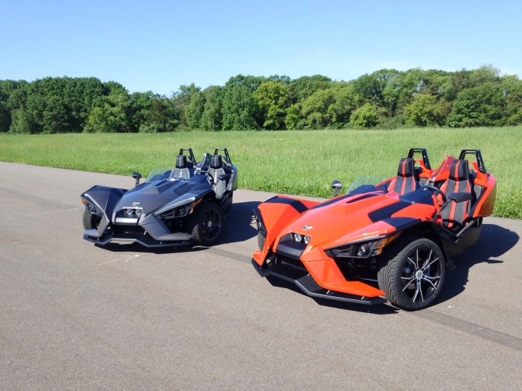 Polaris Slingshot three wheeler press shot red and black