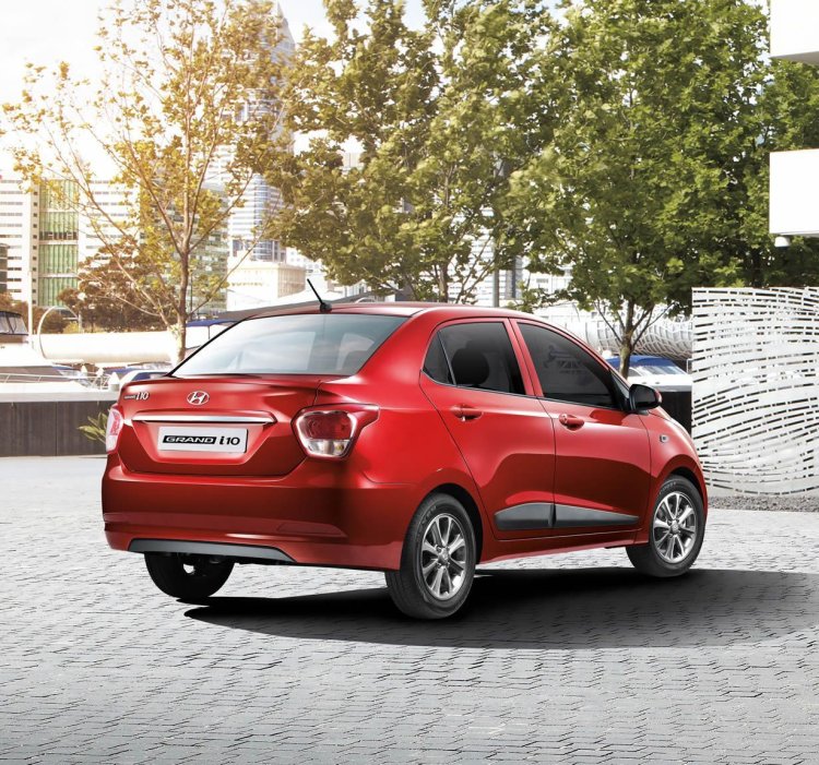Hyundai Grand i10 Sedan (Xcent) rear three quarter press shot