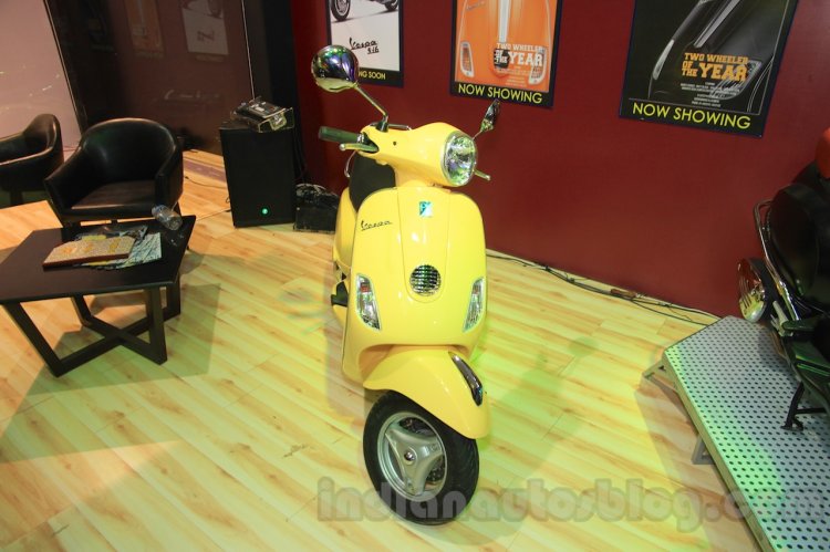 Vespa VX front yellow at Nepal Auto Show 2015