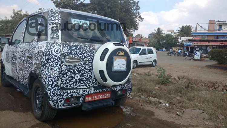New Mahindra Canto Quanto facelift rear quarter camouflaged spyshot