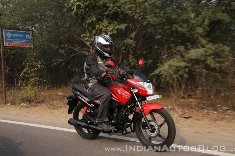 2018 Hero Passion XPro First Ride Review right side closeup tracking shot
