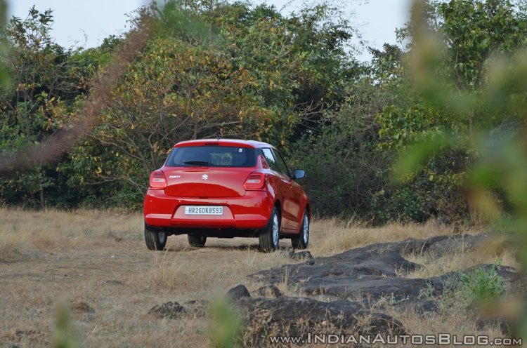2018 Maruti Swift test drive review rear three quarters far