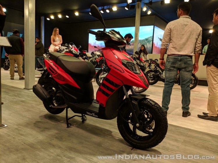 Aprilia Storm Red front right quarter at 2018 Auto Expo
