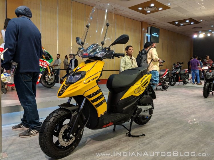 Aprilia Storm Yellow with accessories front left quarter at 2018 Auto Expo