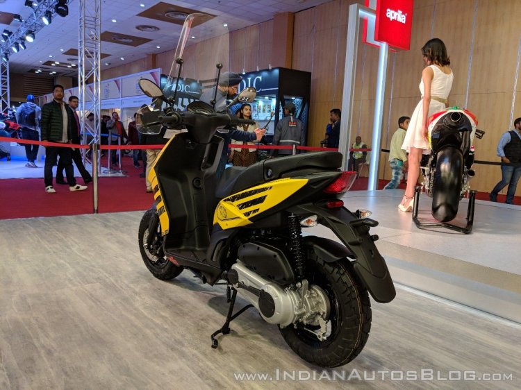 Aprilia Storm Yellow with accessories rear left quarter at 2018 Auto Expo