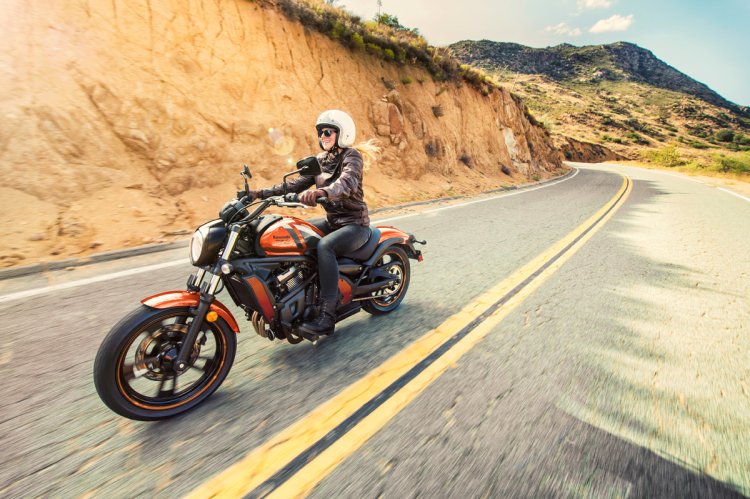 Kawasaki Vulcan S Pearl Lava Orange press front angle action