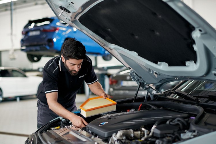 Bmw Summer Service Campaign Mechanic Replacing Air