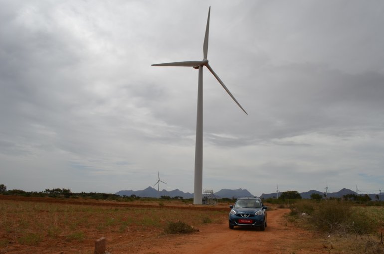 2013 Nissan Micra by a windmill